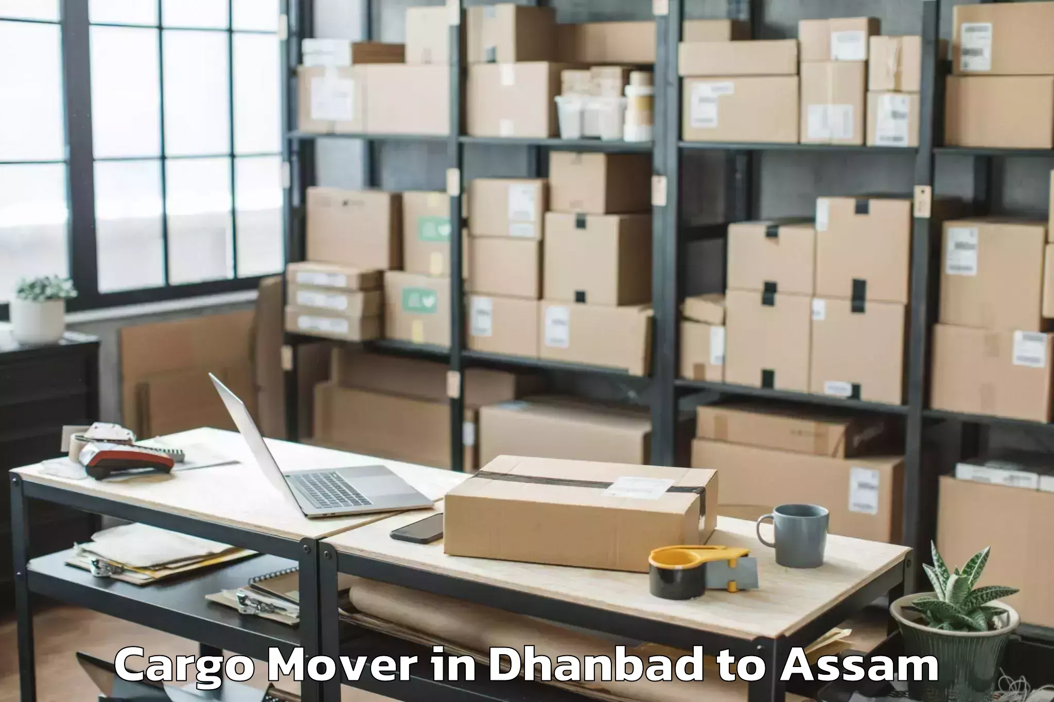 Dhanbad to Marigaon Cargo Mover Booking